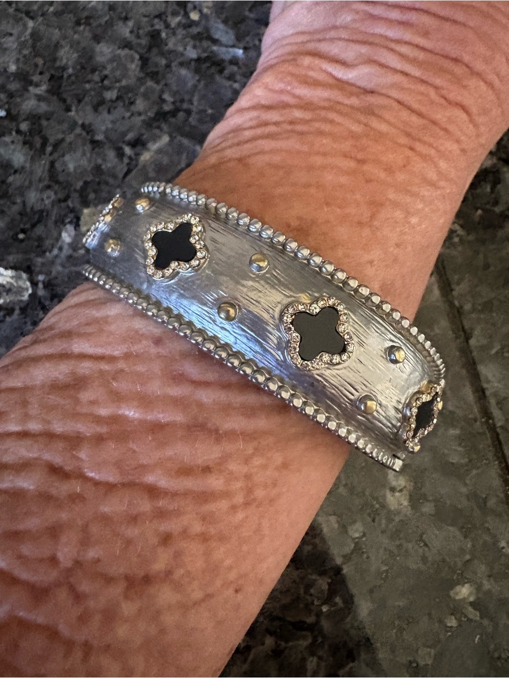 Silver-Tone Bangle Bracelet with Black Clover Insets
